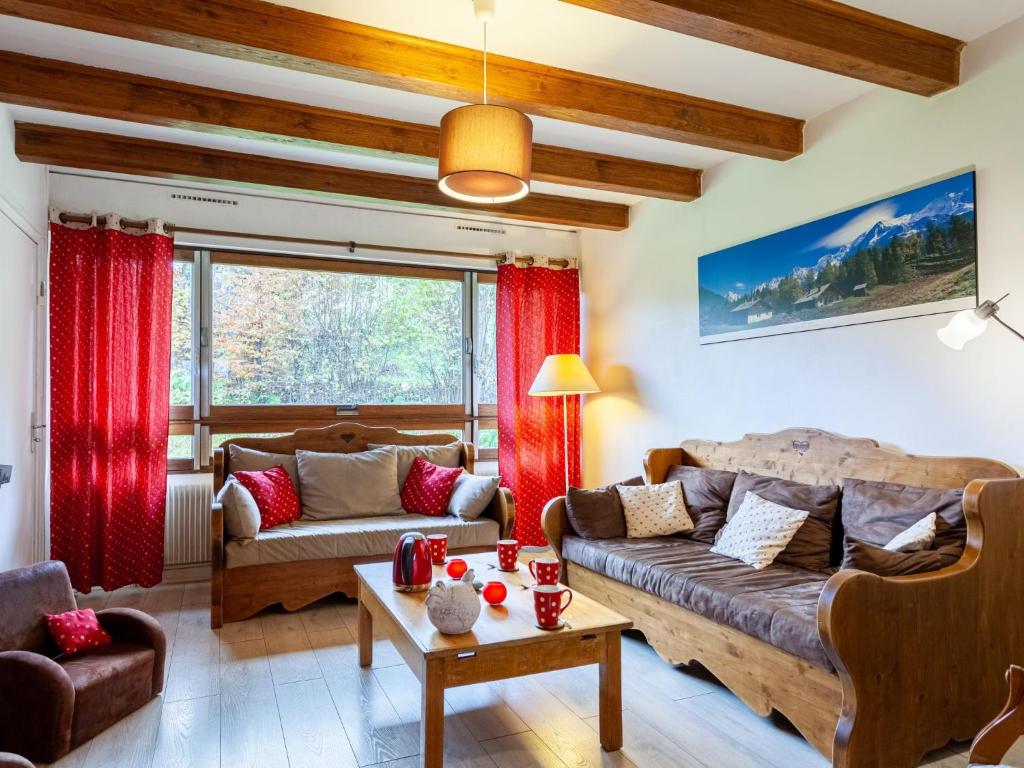 a living room with a couch and a table at Apartment Le Diorama by Interhome in Saint-Gervais-les-Bains