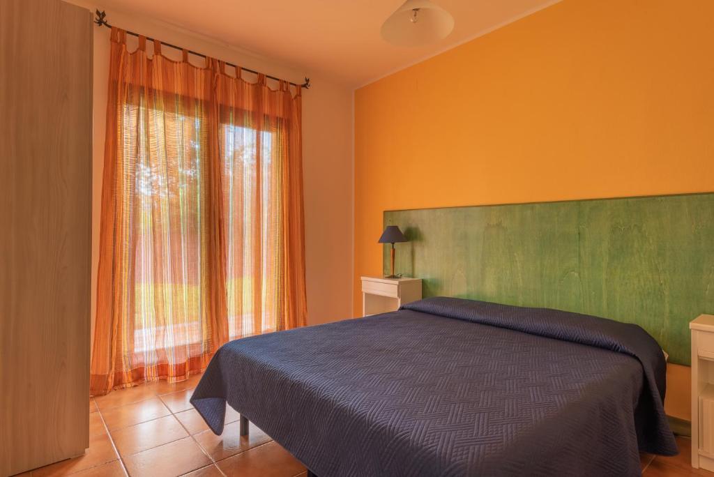 Cama o camas de una habitación en Residence I Mirti Bianchi