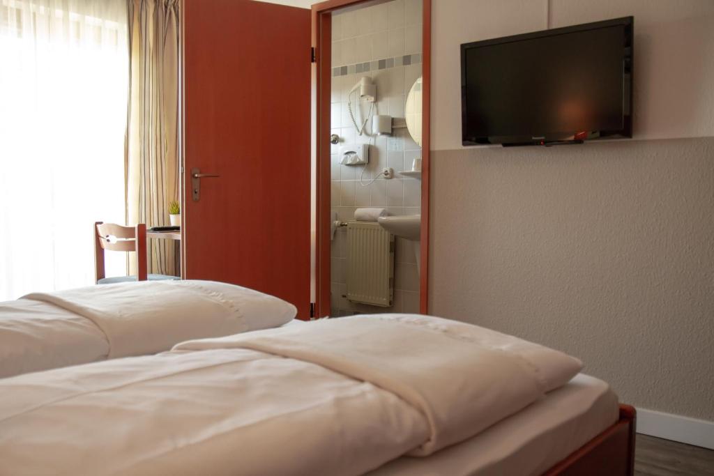 Postel nebo postele na pokoji v ubytování Hotel Bastei