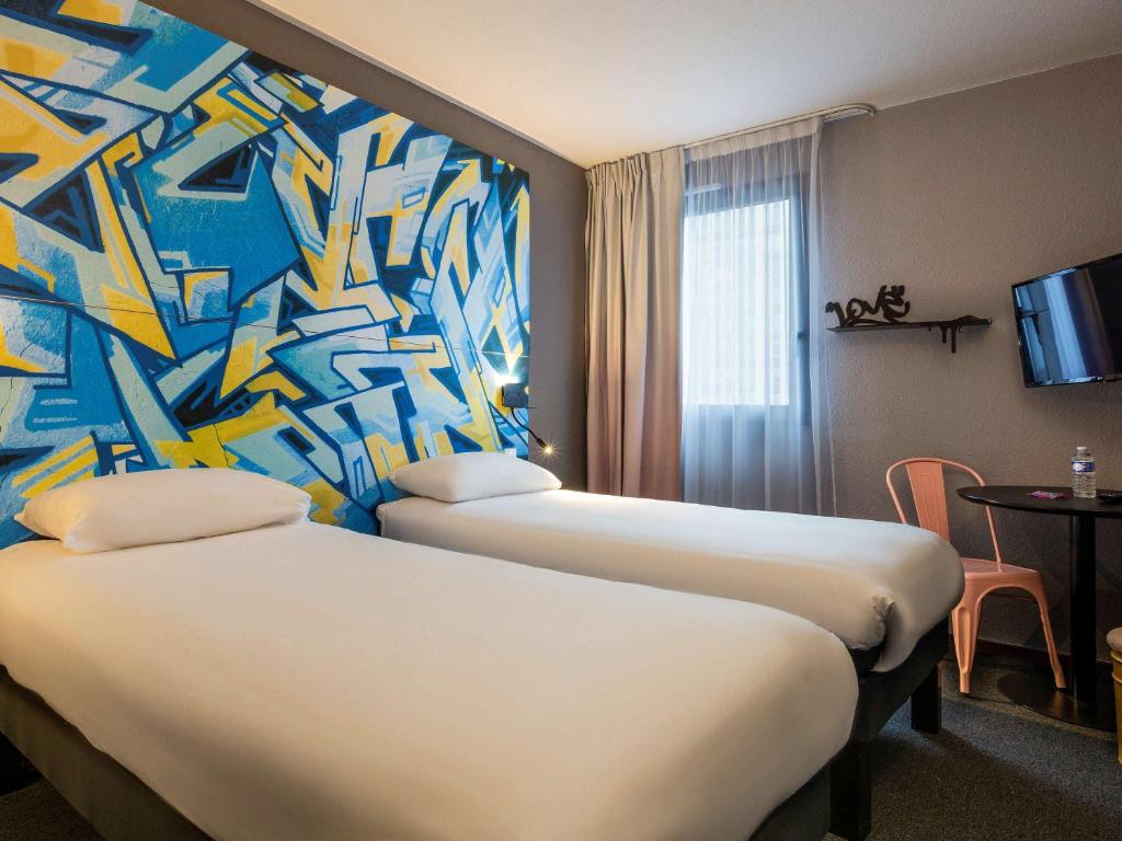 Postel nebo postele na pokoji v ubytování Ibis Styles Toulouse Centre Canal du Midi