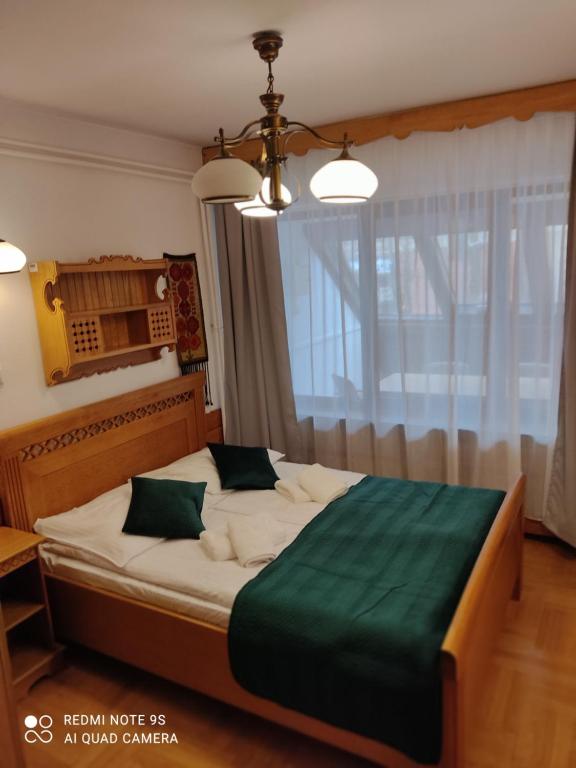 Posteľ alebo postele v izbe v ubytovaní Pokoje Gościnne Zakopane