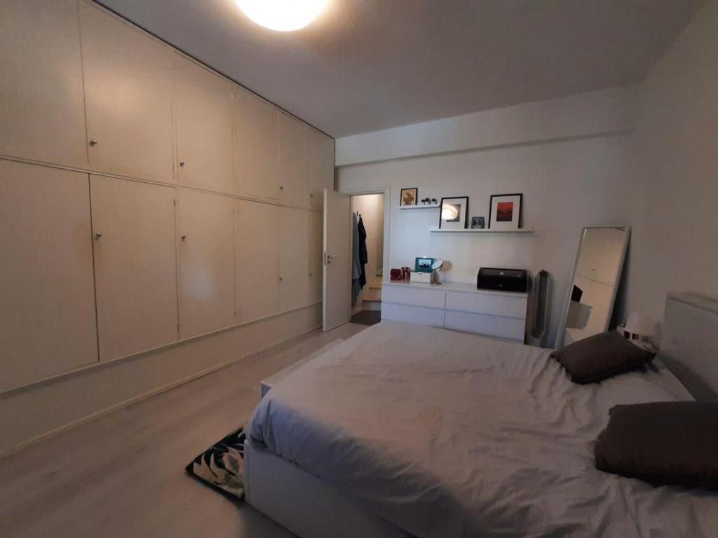 A bed or beds in a room at The secret window on the river Arno