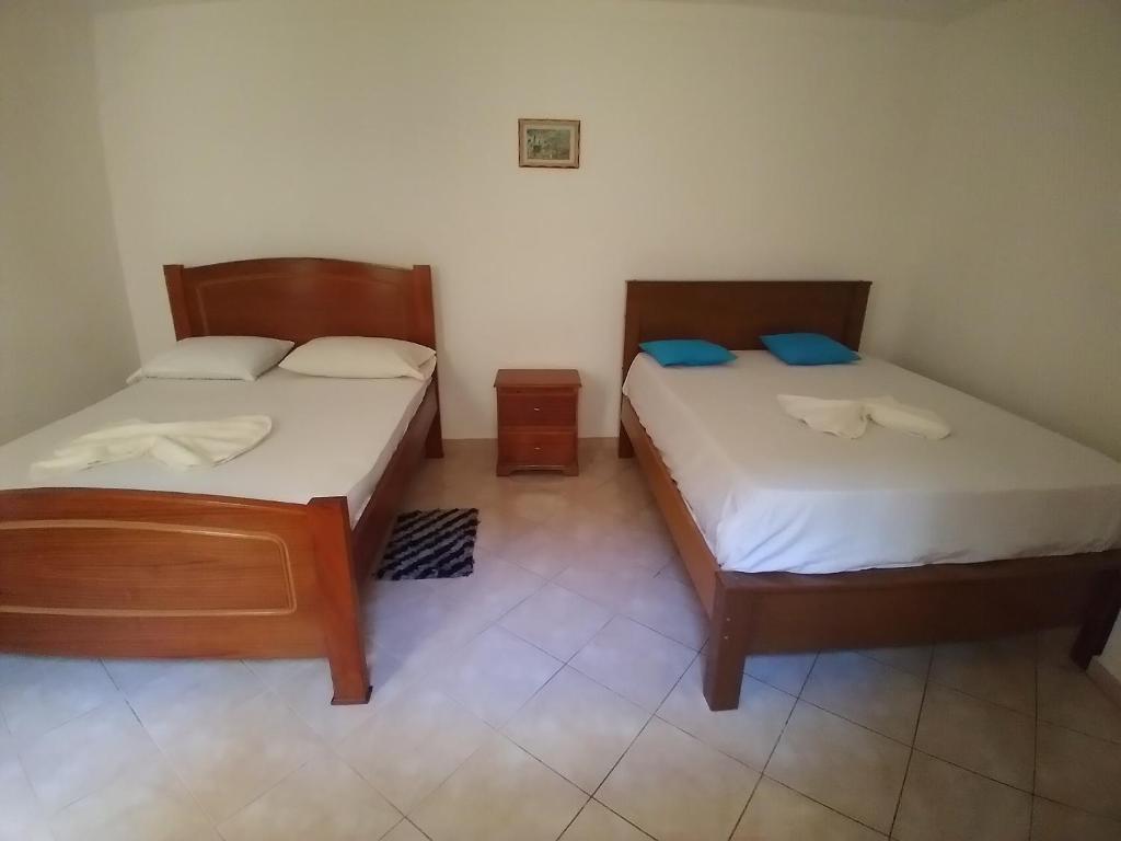 Postel nebo postele na pokoji v ubytování Pensão Domingas