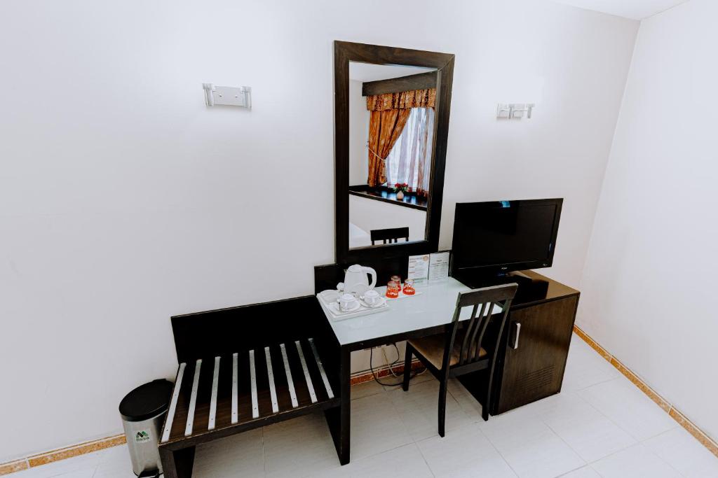 TV a/nebo společenská místnost v ubytování Panorama Hotel Deira