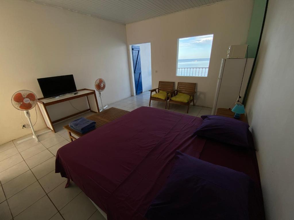 Postel nebo postele na pokoji v ubytování Appartements les pieds dans l'eau