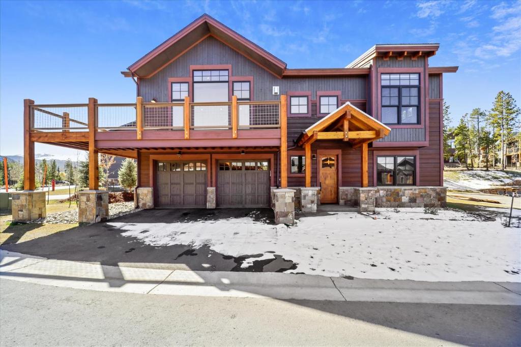 a large house with a deck on top of it at Cocoa Cabin home in Breckenridge