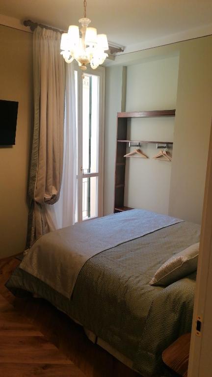 A bed or beds in a room at Al Molo di Sant'Agostino
