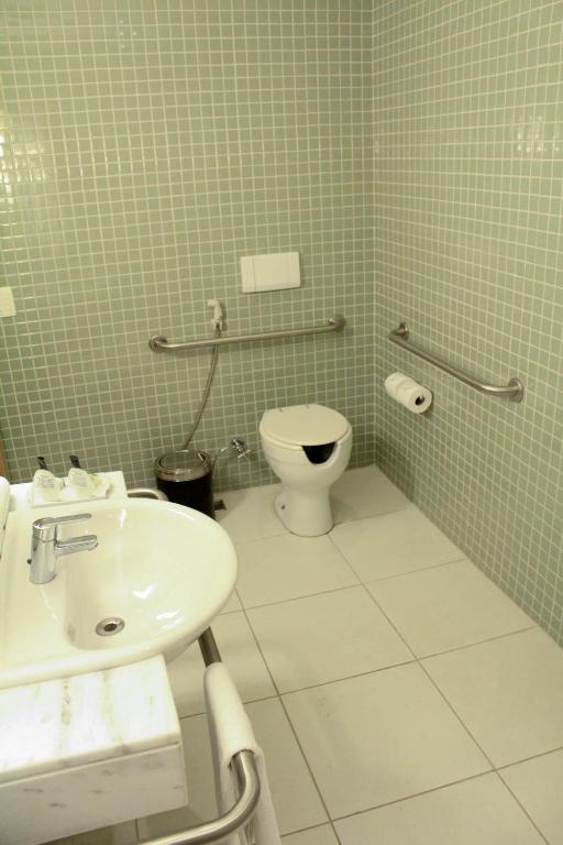 Um banheiro em eSuites Savassi Toscanini