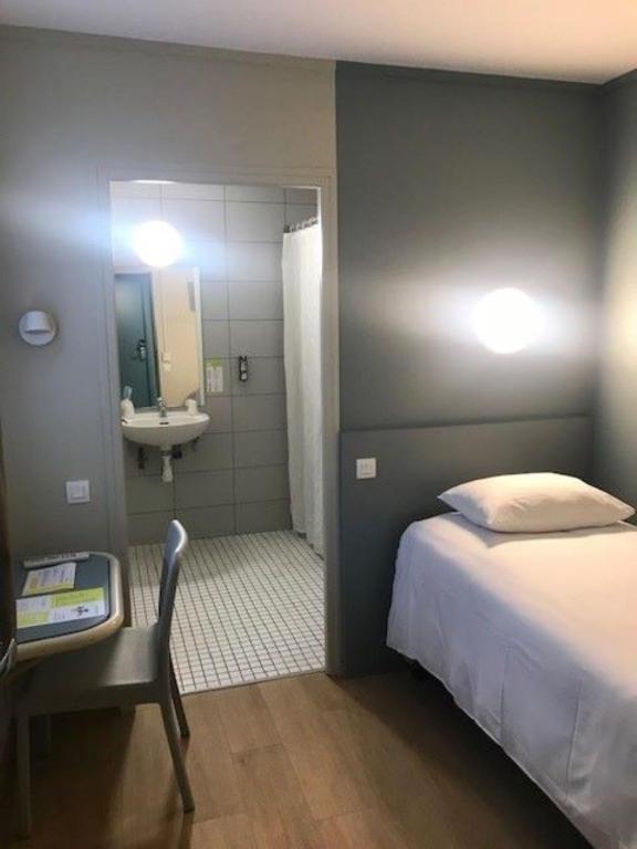 Postel nebo postele na pokoji v ubytování Vini Hotel
