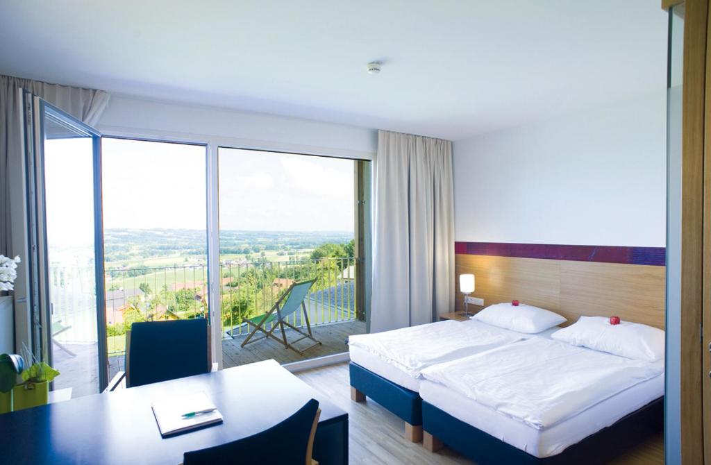 A bed or beds in a room at SPES Hotel & Seminare