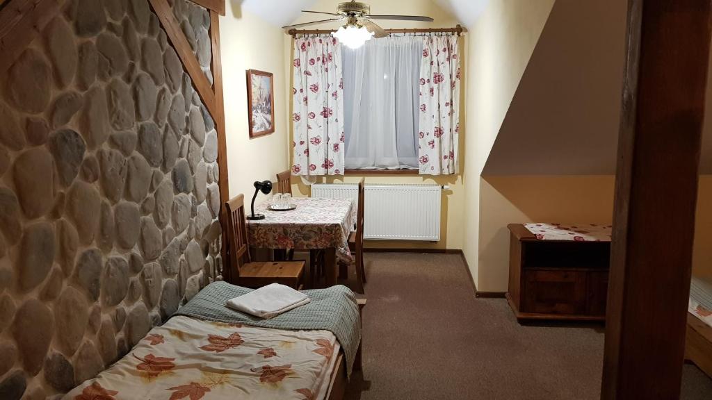 Posteľ alebo postele v izbe v ubytovaní Karczma na Woli