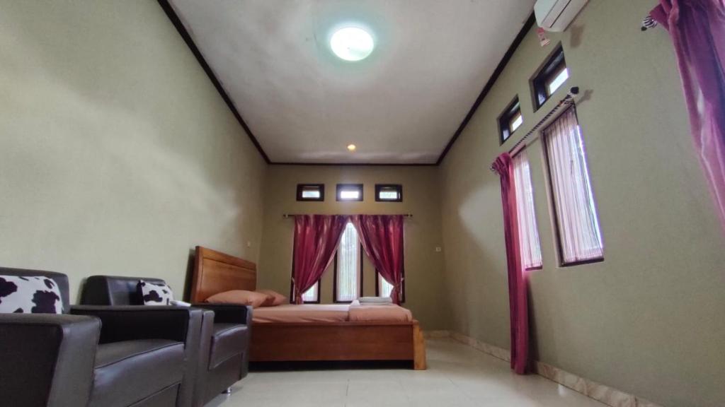 Postel nebo postele na pokoji v ubytování G-Rima Home Stay