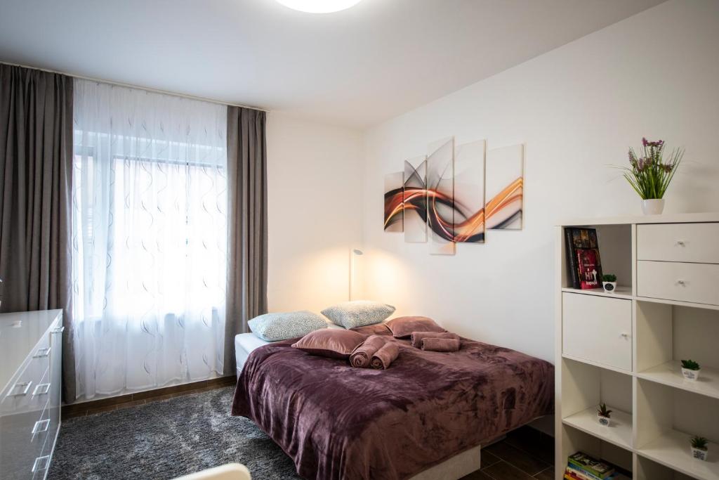 Posteľ alebo postele v izbe v ubytovaní Cute apartman- free parking