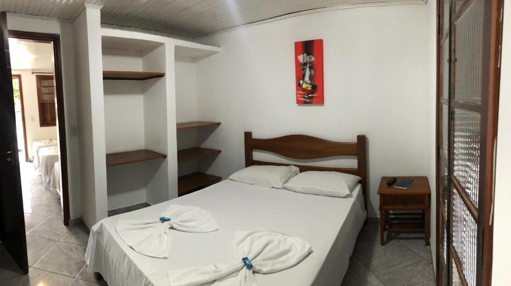 Ένα ή περισσότερα κρεβάτια σε δωμάτιο στο Hotel Pousada Nosso Cantinho