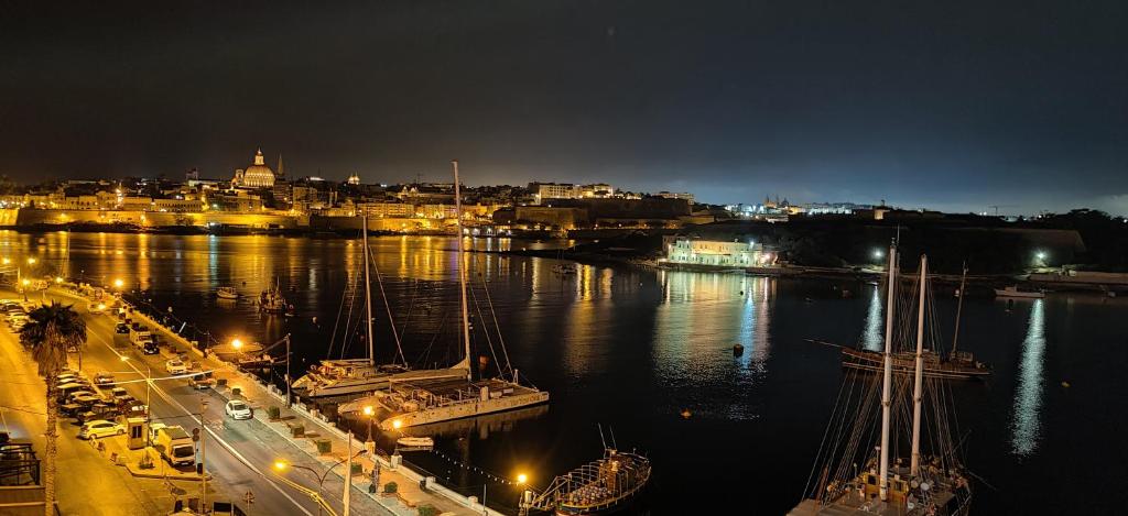 a large body of water with boats docked at Sliema Marina Hotel in Sliema
