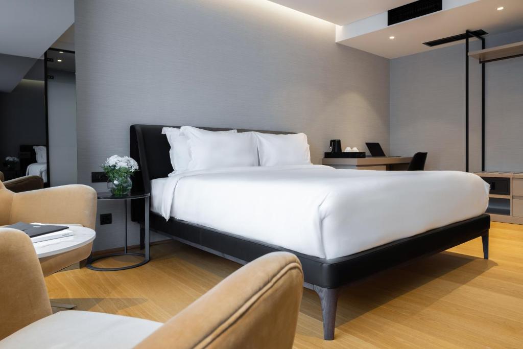 Postel nebo postele na pokoji v ubytování Hotel MANAMI