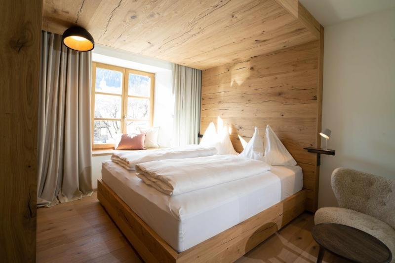 Postel nebo postele na pokoji v ubytování Mesnerhaus & Gourmetrestaurant Mesnerhaus mit 4 Hauben