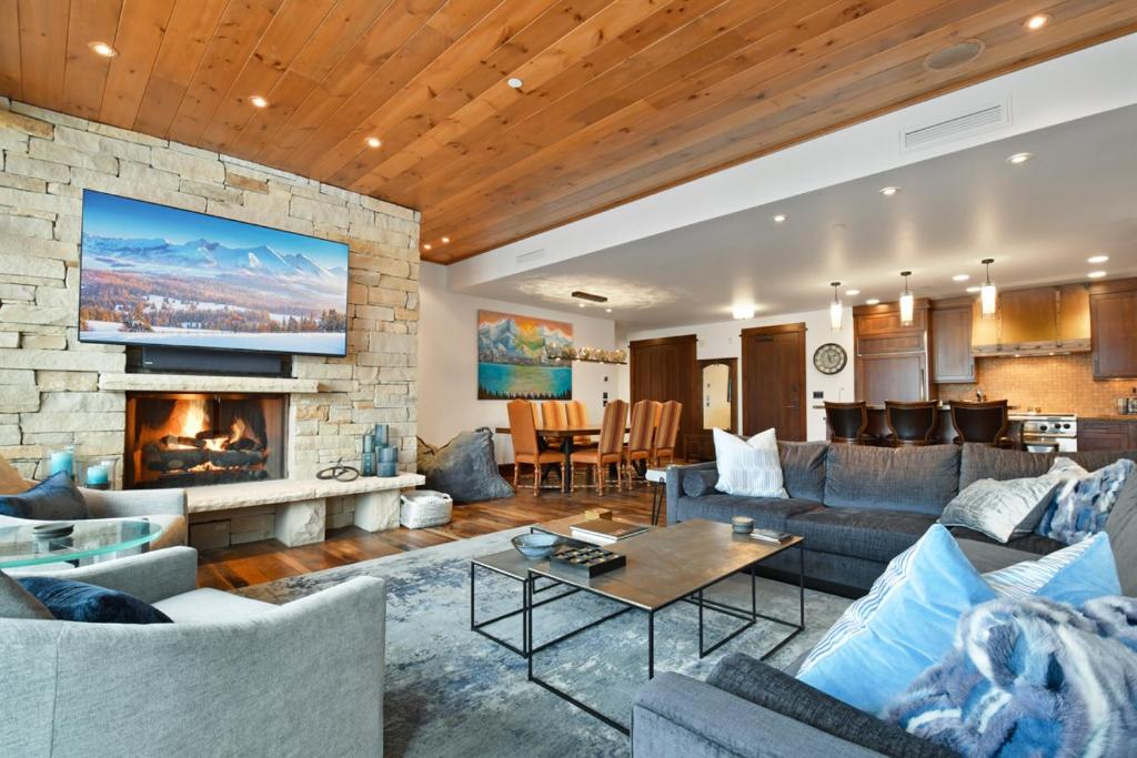 a living room with couches and a fireplace at Arrowleaf Lodge - 3 Bed Condo #311 in Park City