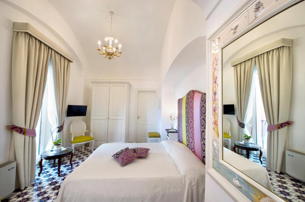 Postel nebo postele na pokoji v ubytování Palazzo Pascal