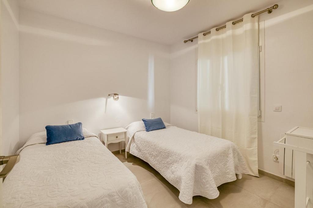 Postel nebo postele na pokoji v ubytování Apartament Roses Vista Mar
