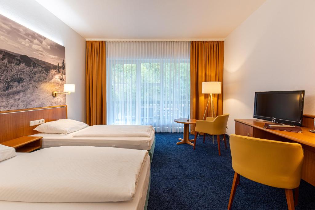 Voodi või voodid majutusasutuse Hotel-Gasthof Hüttensteinach toas