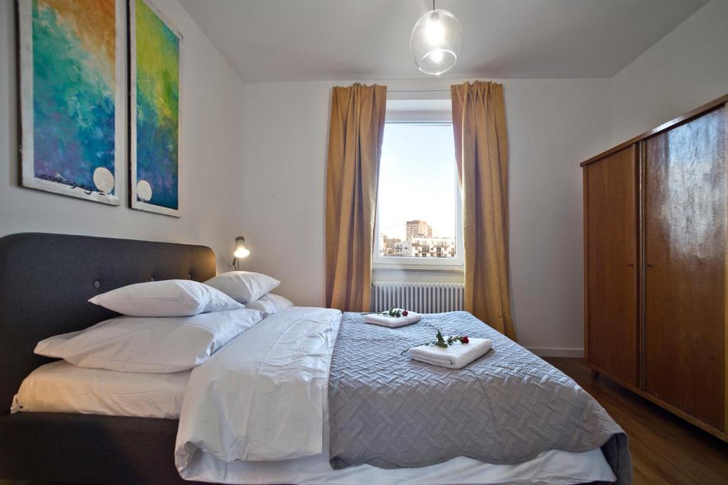 Posteľ alebo postele v izbe v ubytovaní Zoliborz P&O Serviced Apartments