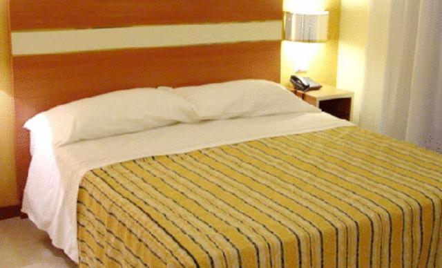 Postel nebo postele na pokoji v ubytování Hotel GF