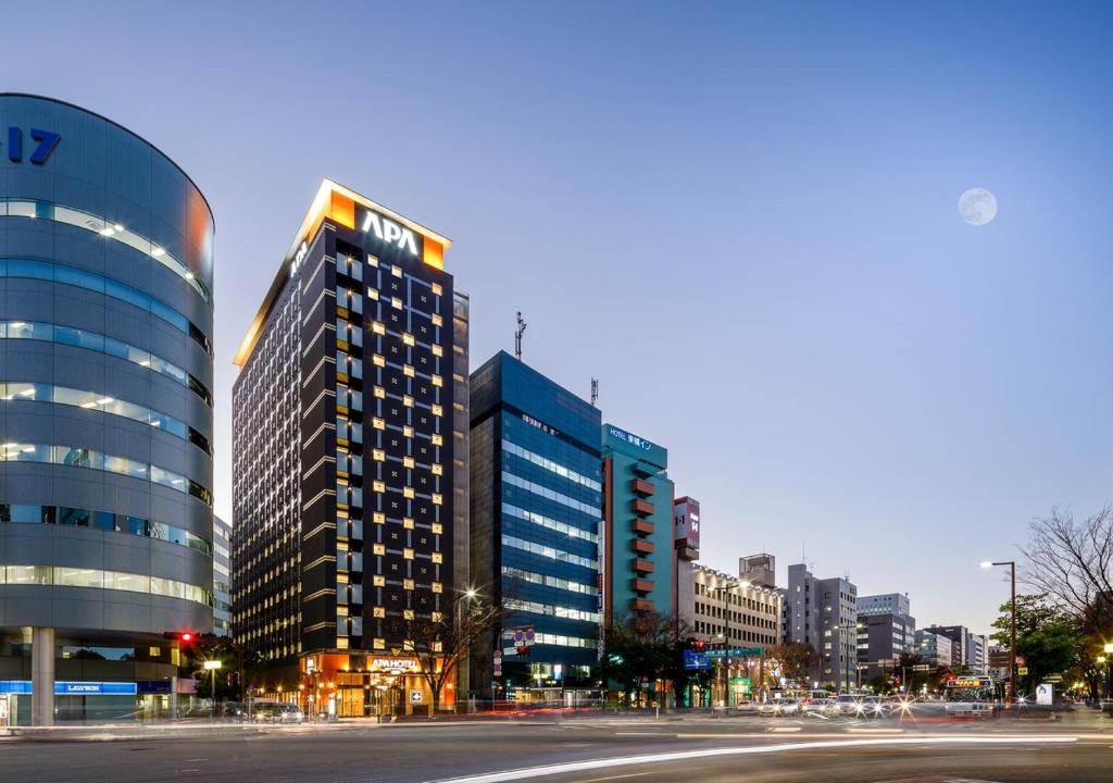 a city with tall buildings and a street at APA Hotel Hakata Gion Ekimae in Fukuoka
