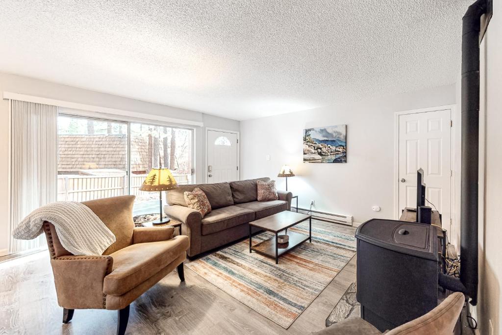 a living room with a couch and a tv at North Tahoe Nest in Incline Village