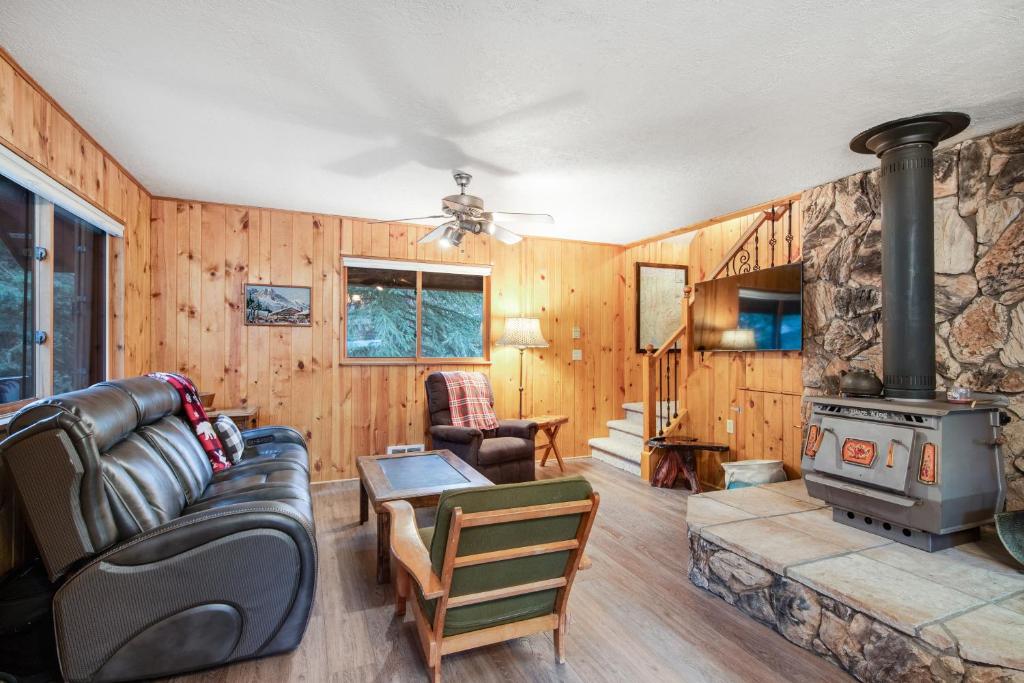 a living room with a couch and a stove at The Legacy in McCall