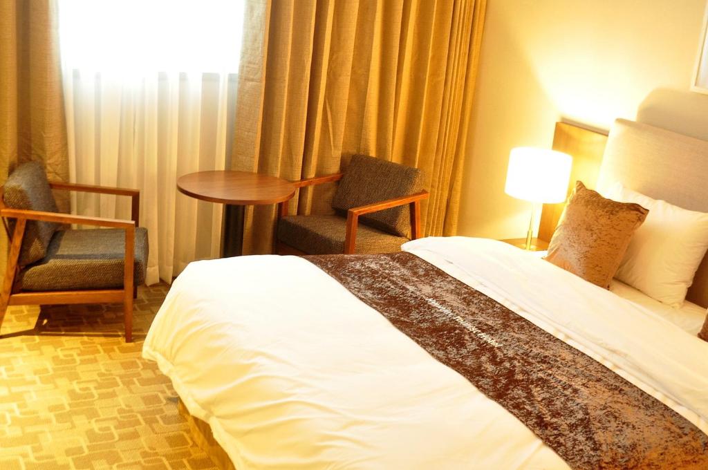 Postel nebo postele na pokoji v ubytování Hyunjin Tourist Hotel