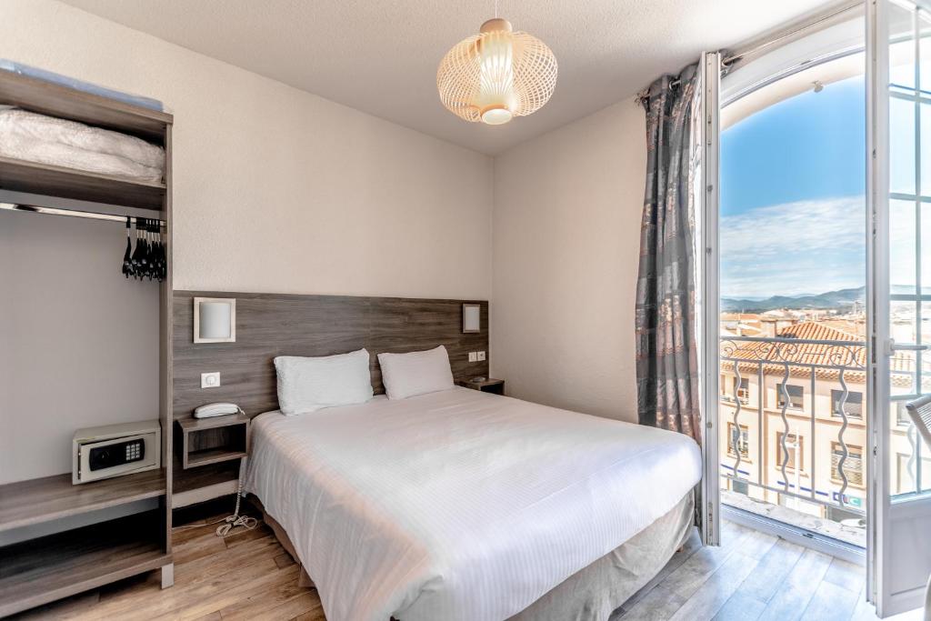 Postel nebo postele na pokoji v ubytování Hotel Le 21