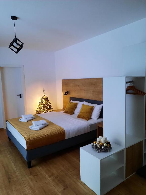 Postel nebo postele na pokoji v ubytování Apartmány Runi