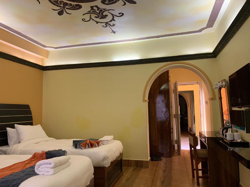 Postel nebo postele na pokoji v ubytování Hotel ABC, Boutique Hotel in Pokhara