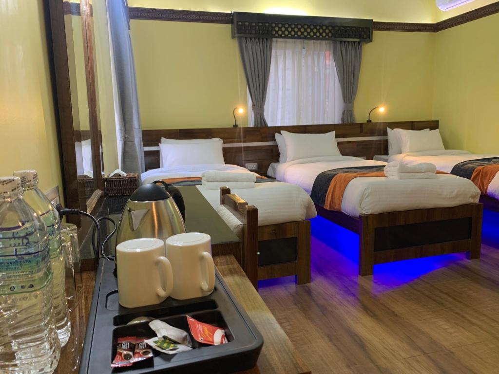 Postel nebo postele na pokoji v ubytování Hotel ABC, Boutique Hotel in Pokhara