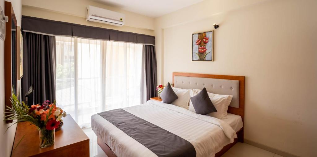 Postel nebo postele na pokoji v ubytování Hotel Reemz Beach Heaven , Anjuna