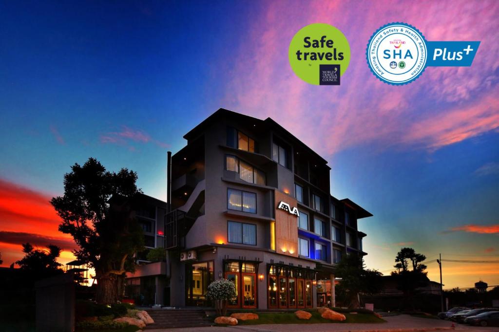 a rendering of a hotel at sunset with a sign that says safe travels at Hatyai Signature Hotel in Hat Yai