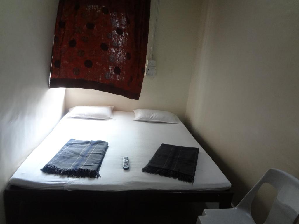 Postel nebo postele na pokoji v ubytování Hotel Rajmandir