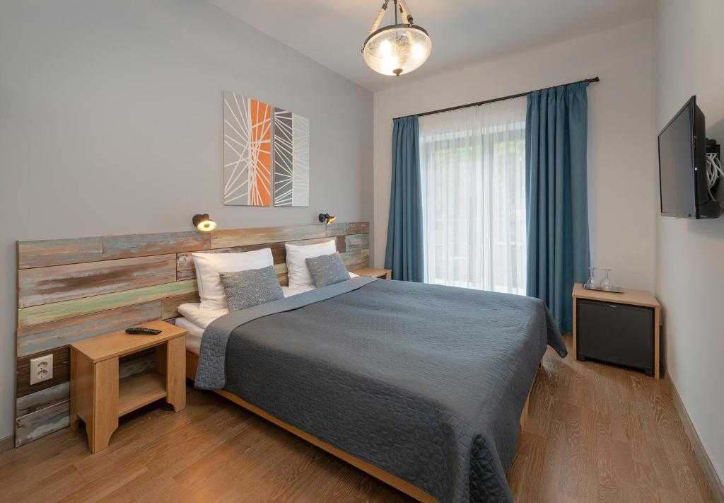 Postel nebo postele na pokoji v ubytování Butikhotel Visegrád