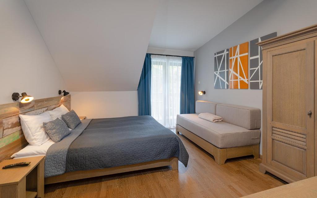 Postel nebo postele na pokoji v ubytování Butikhotel Visegrád