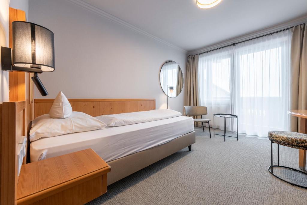 Posteľ alebo postele v izbe v ubytovaní Hotel Jakob