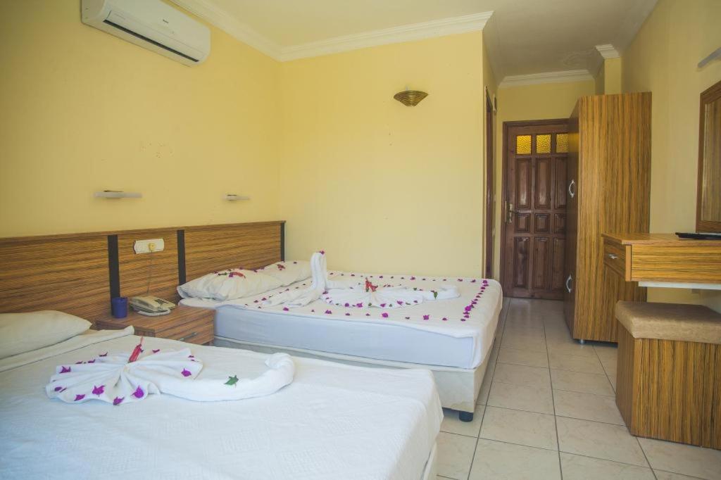 Postel nebo postele na pokoji v ubytování KEMER STAR HOTEL