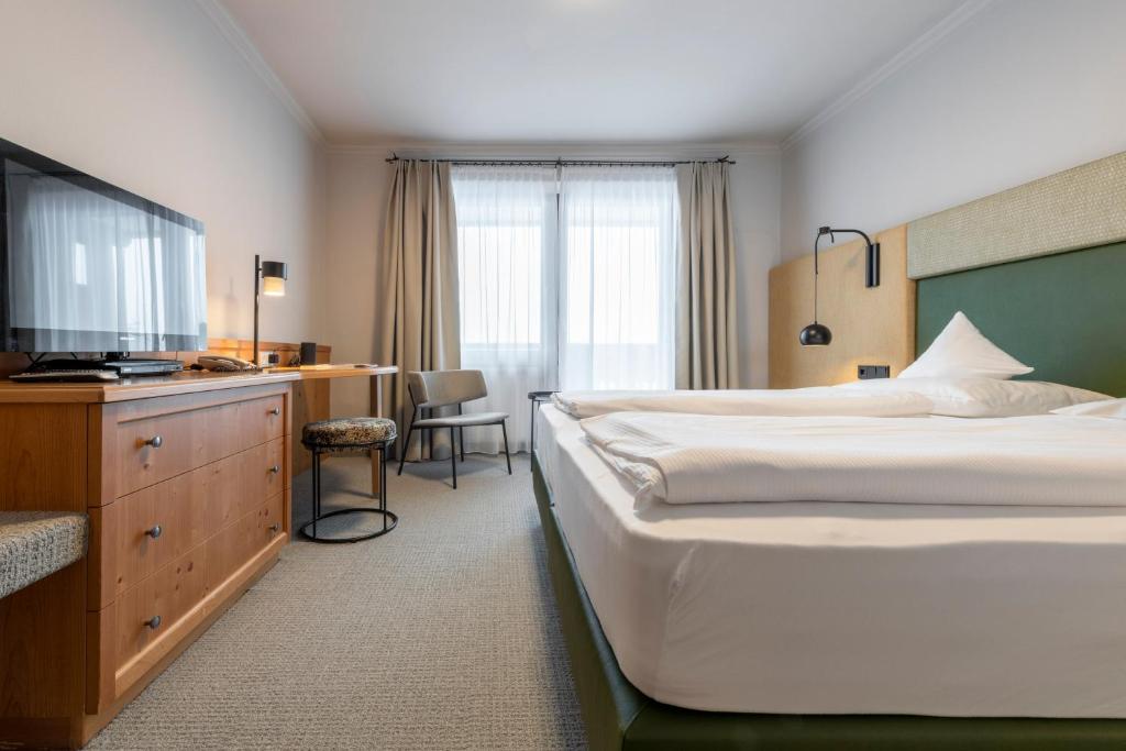 Posteľ alebo postele v izbe v ubytovaní Hotel Jakob