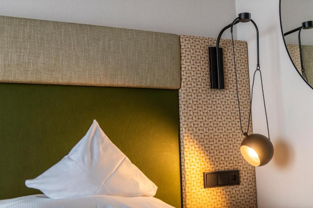 Posteľ alebo postele v izbe v ubytovaní Hotel Jakob