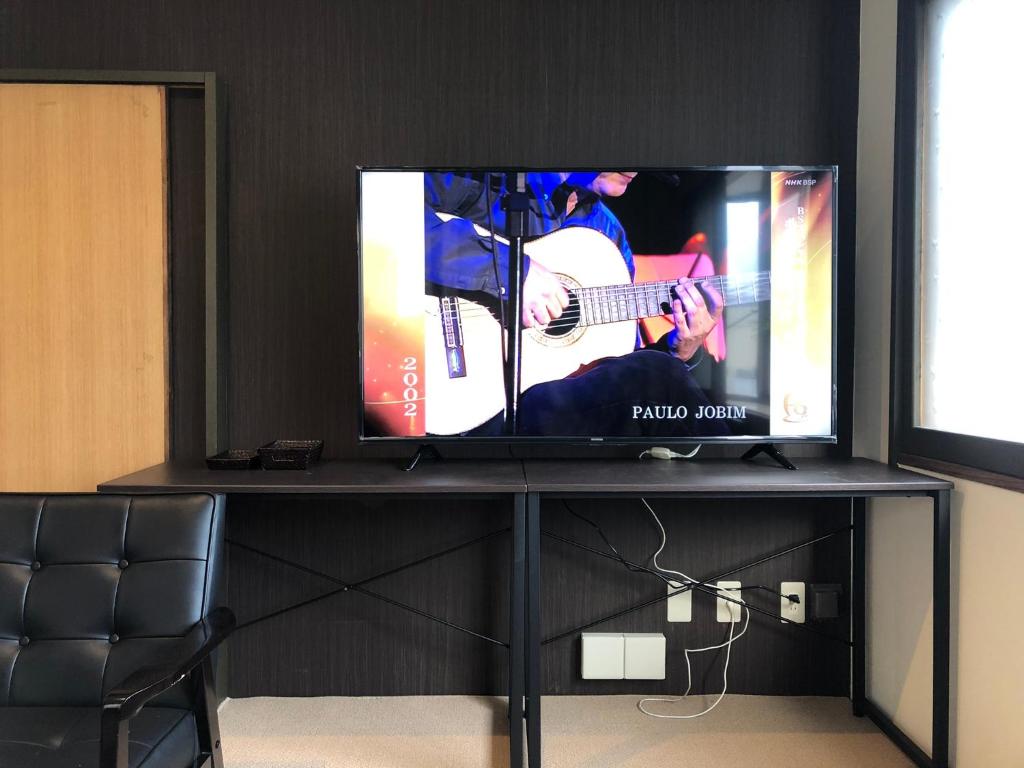 TV a/nebo společenská místnost v ubytování Cool-inn Otaru