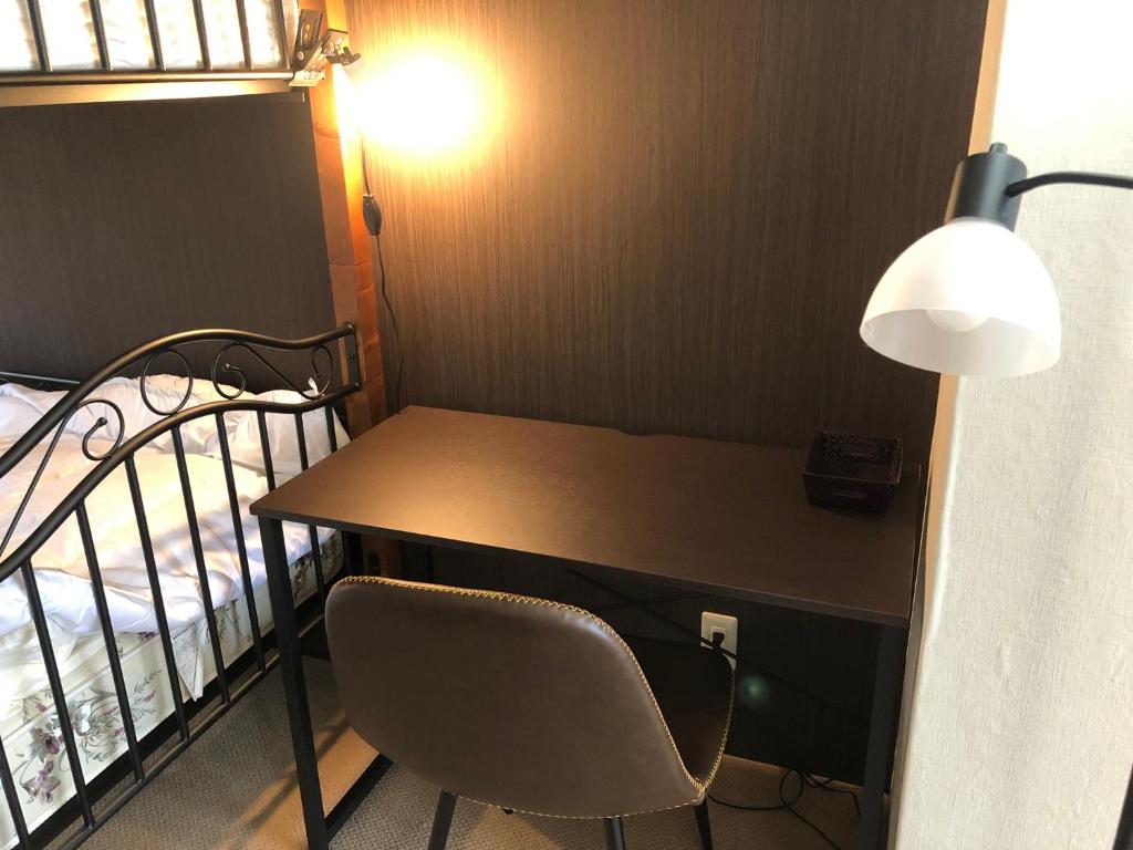 Postel nebo postele na pokoji v ubytování Cool-inn Otaru