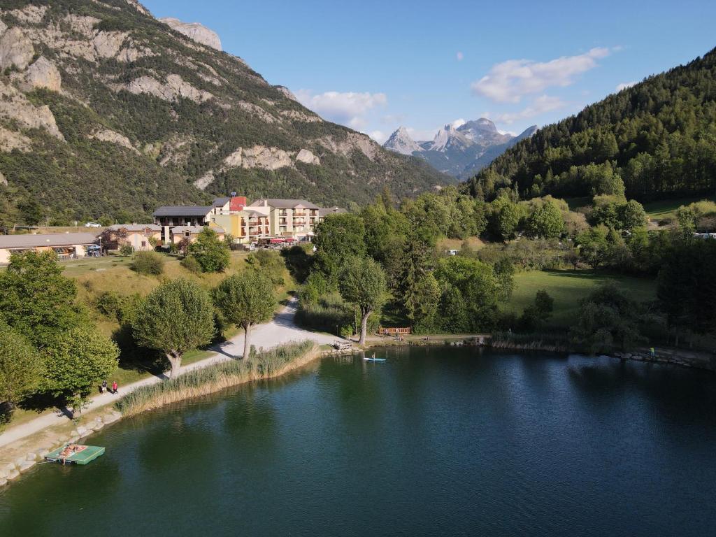 a view of a river with mountains in the background at Hotel-Restaurant La Lauzétane in Le Lauzet-Ubaye