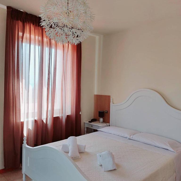 Postel nebo postele na pokoji v ubytování Hotel Valbella