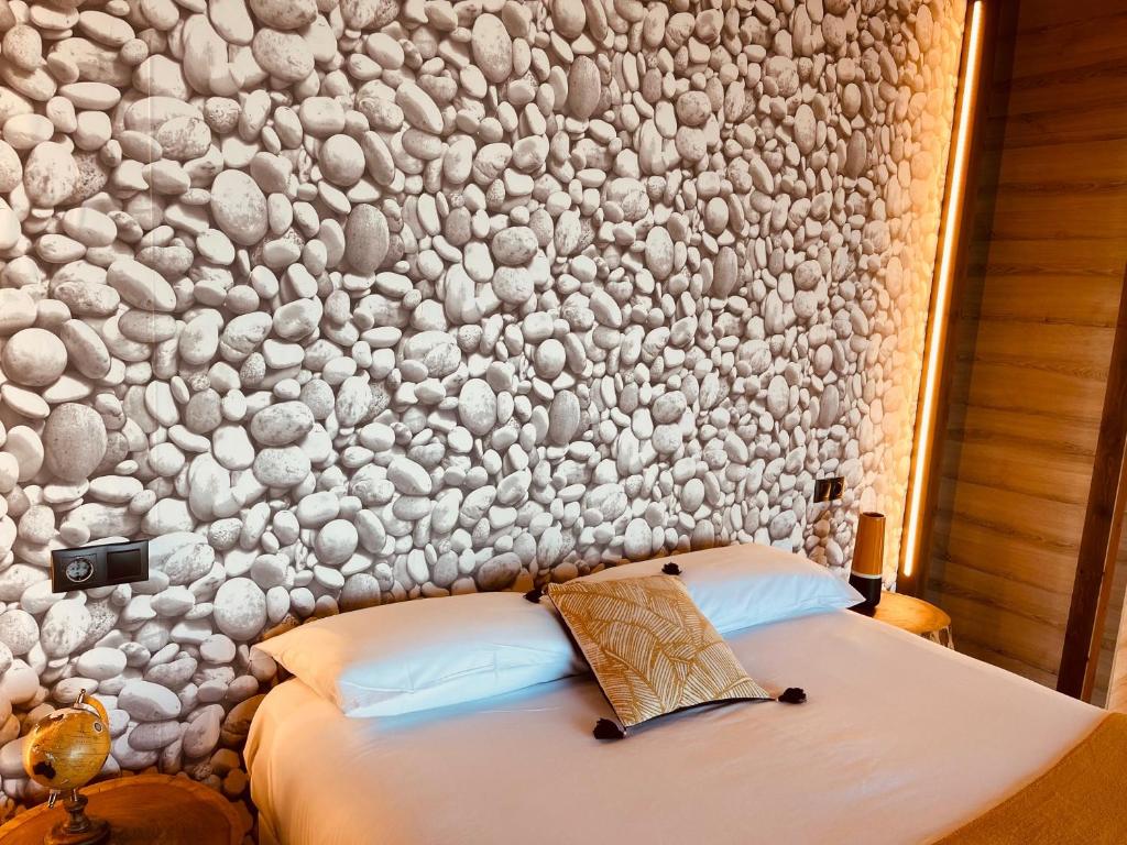 Cama o camas de una habitación en Cabañas Fisterra