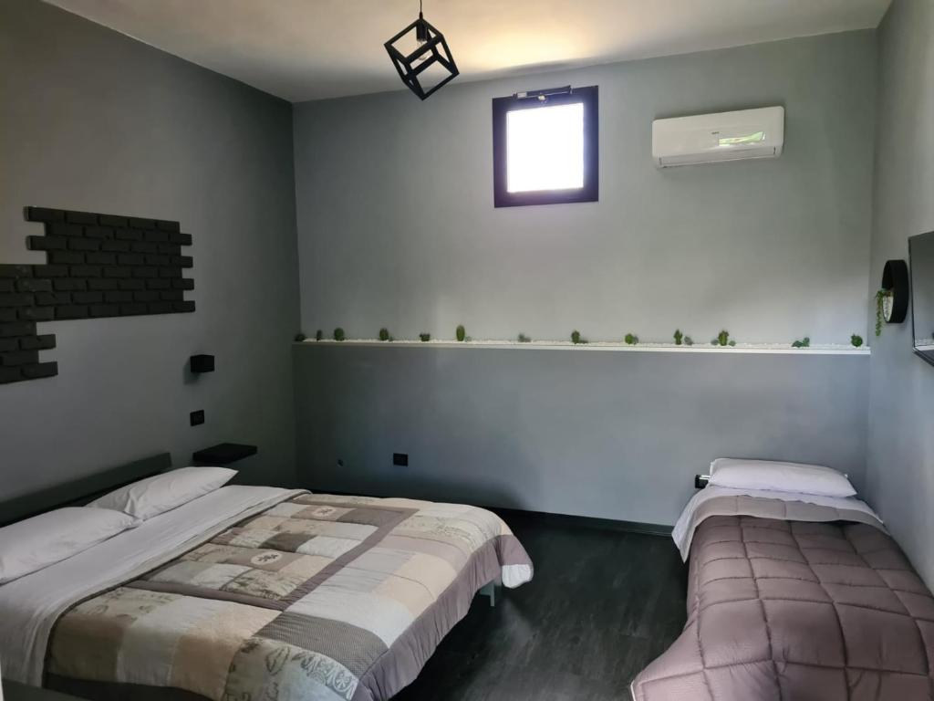 Posteľ alebo postele v izbe v ubytovaní B&B Villa Hermes